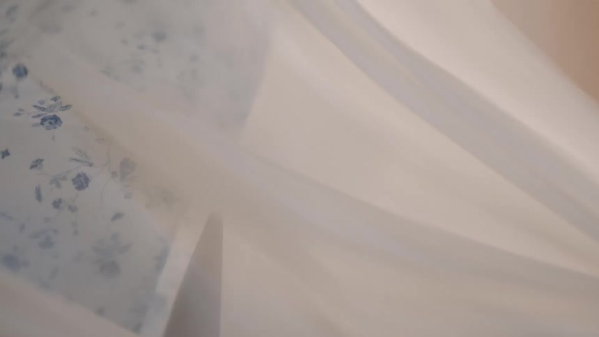 Youth grabs and pulls a piece of white fabric
