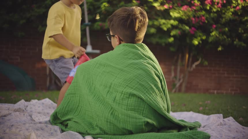 Two boys in a backyard