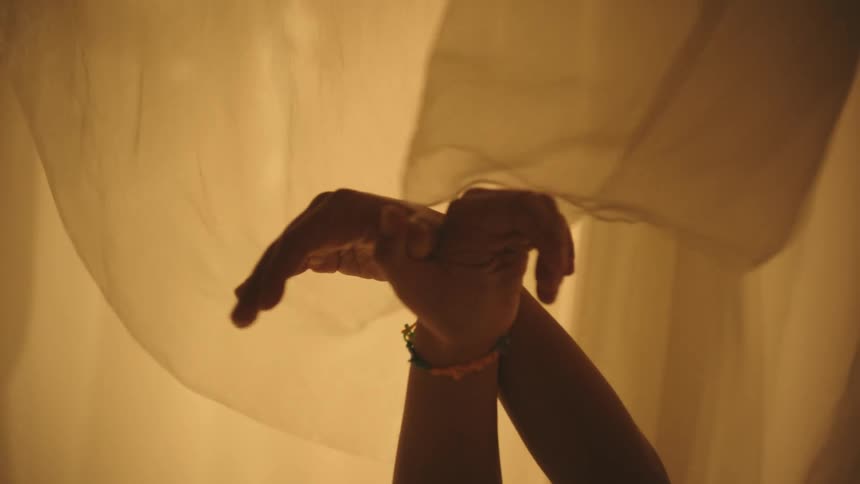 Hands of a child making a gesture and movement of a dove