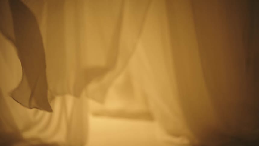 White curtain moving in a room