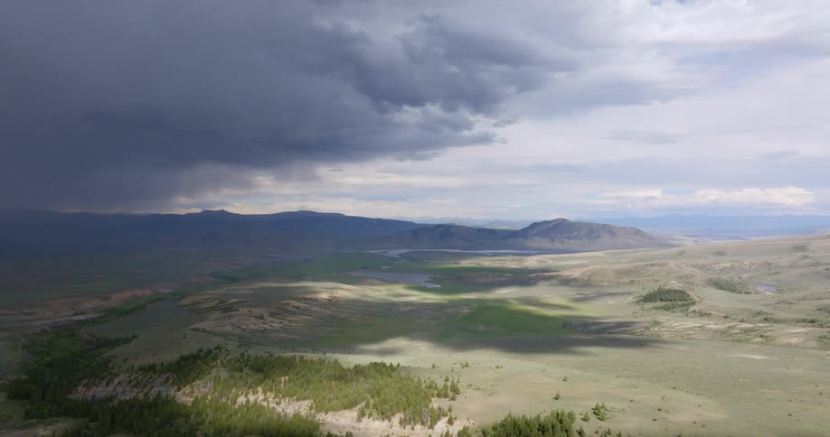 Storm clouds moving over a grass plain