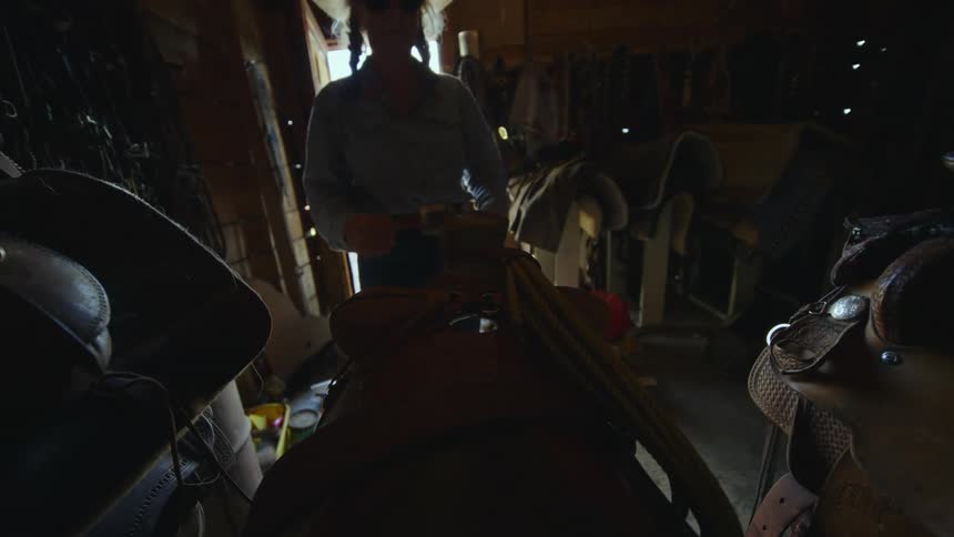 A clip of a lady in a store room