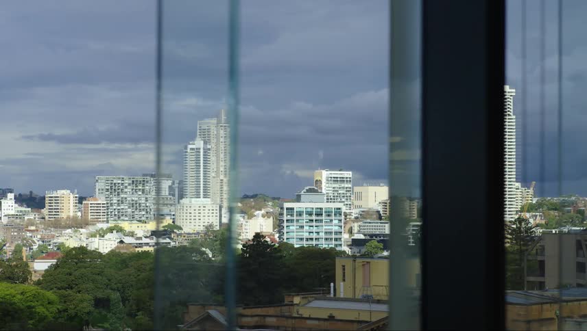 A cityscape viewed through a window pane