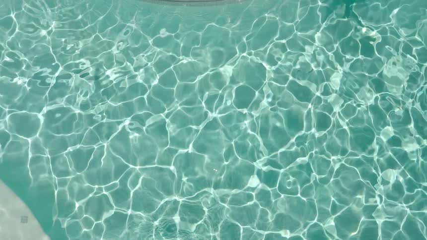 A swimming pool with rippling clear water