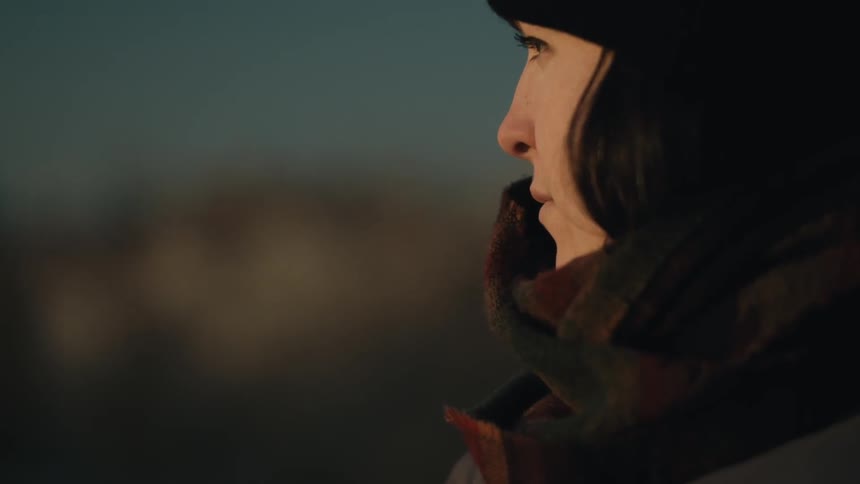 Dark haired woman in a coat