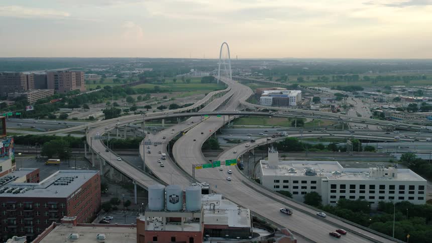 Aerial view of a highway with intersections passing through a city