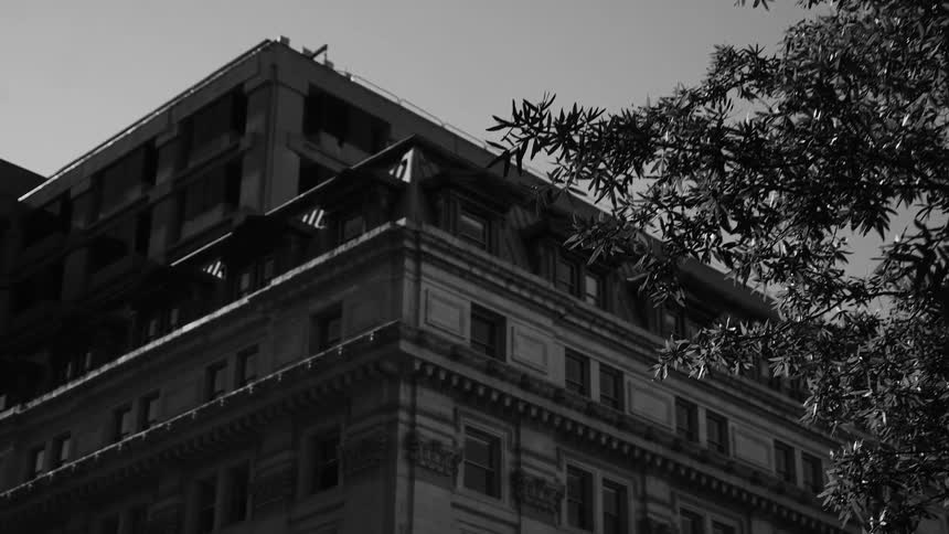 Building with classical architecture against a blue sky