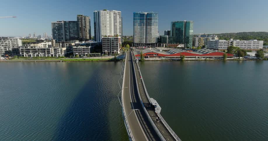 An aerial clip of a metropolis and a connecting bridge