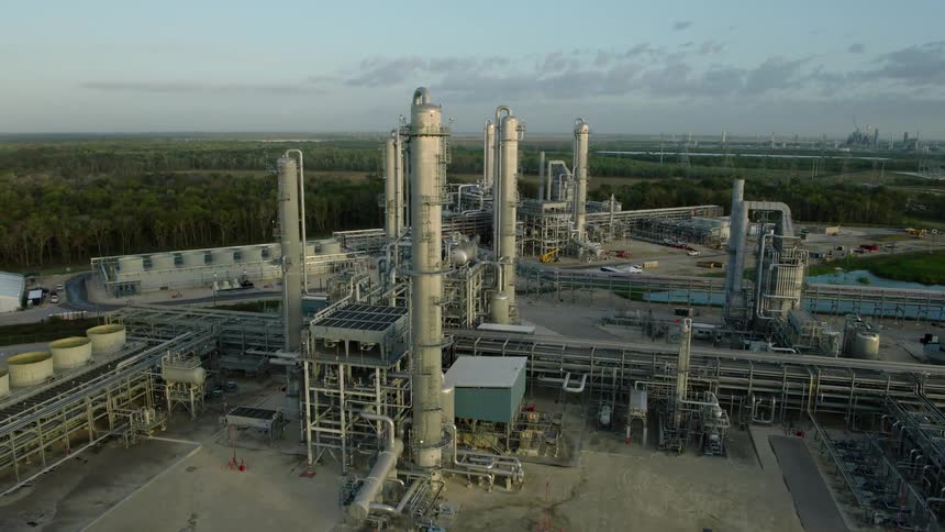 An aerial clip of a factory in the forest
