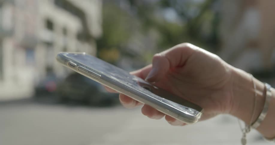Womans hand interacting with an iphone