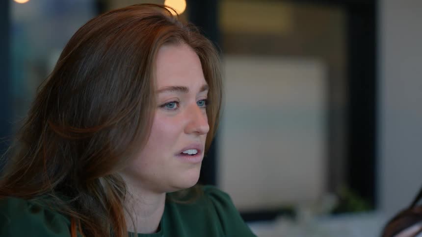 Woman sitting indoors talking