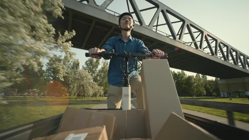 A man is delivering packages with his bicycle POV