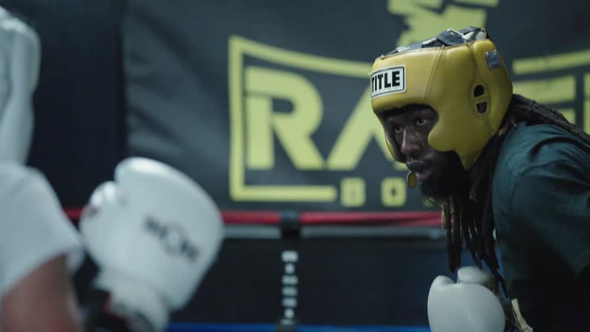 Two boxers spar in the training ring