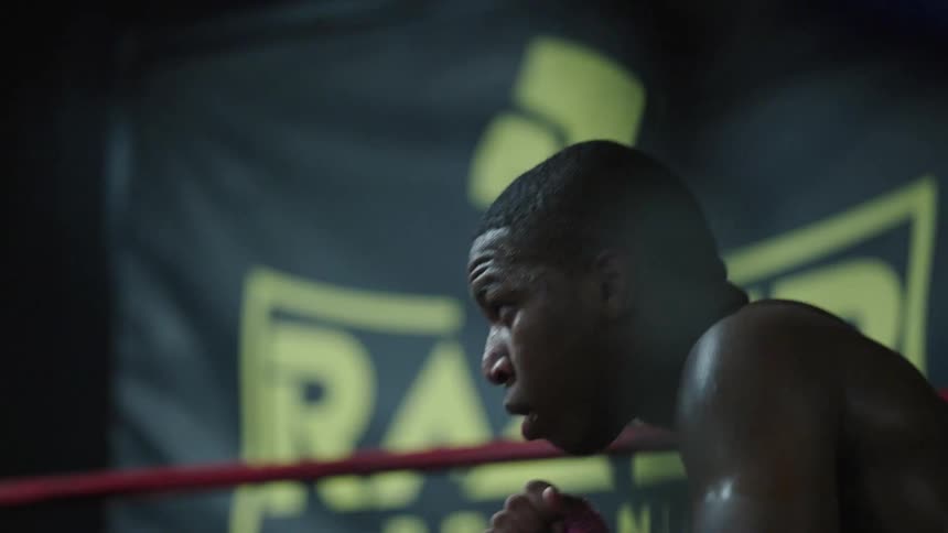 Two men are shadowboxing in the ring