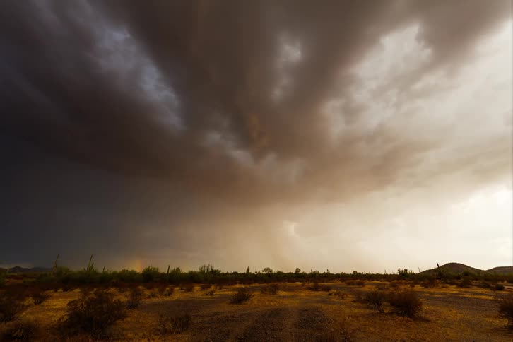 The sky is full of storm clouds pouring rain