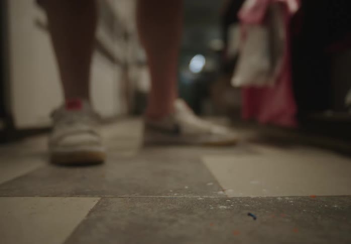 Donut with powdered sugar falling on the floor in Donut Shop, Slow-Motion