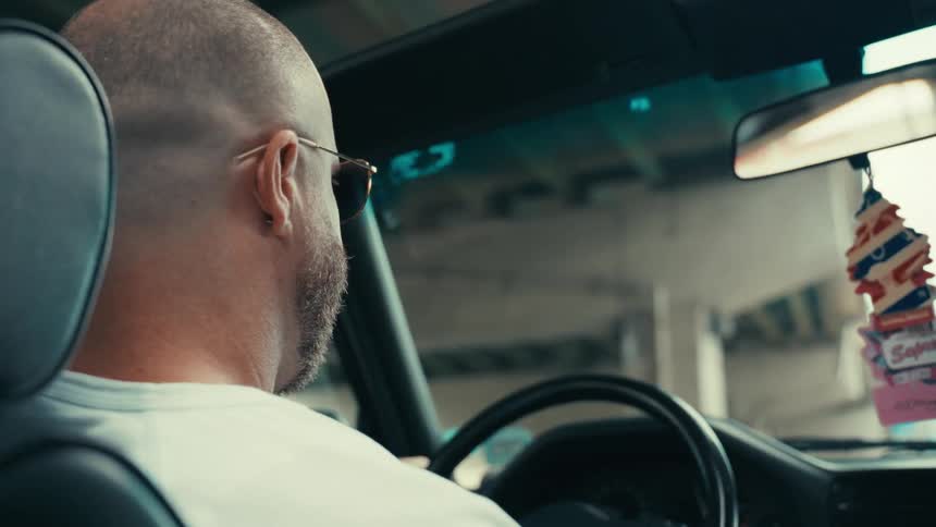 A clip of a male in a car driving