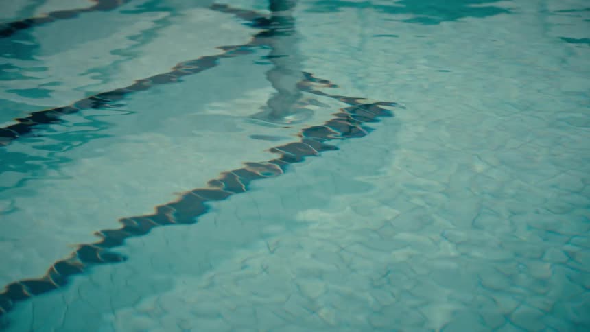 Steps with a guard rail in an empty swimming pool
