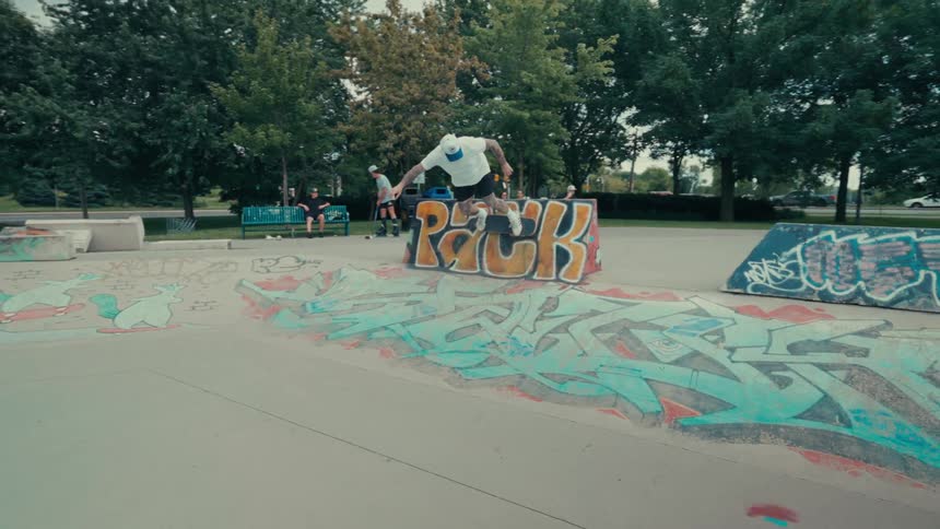 A man is riding the ramps on his skateboard