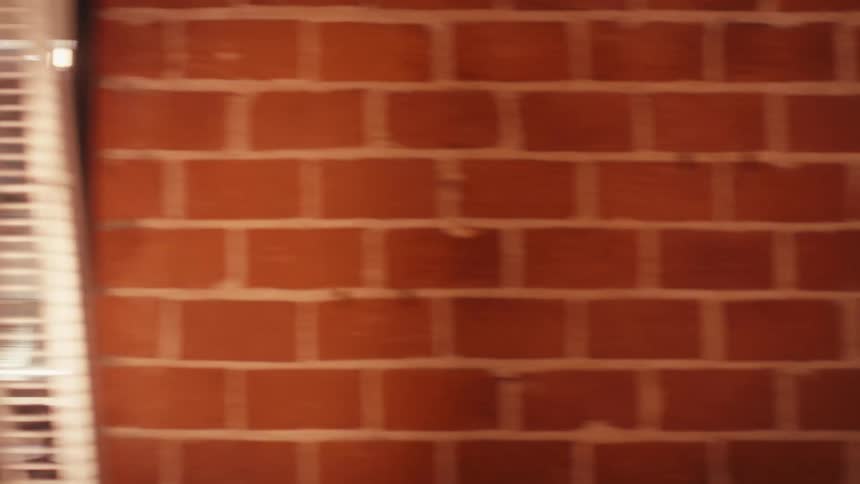A male chef walking through the restaurant