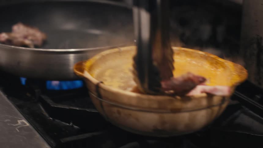 Closeup of Chef's hand cooking and preparing food