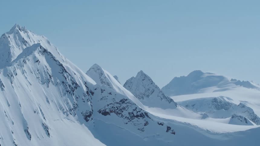 Aerial panorama of snowy mountain ranges