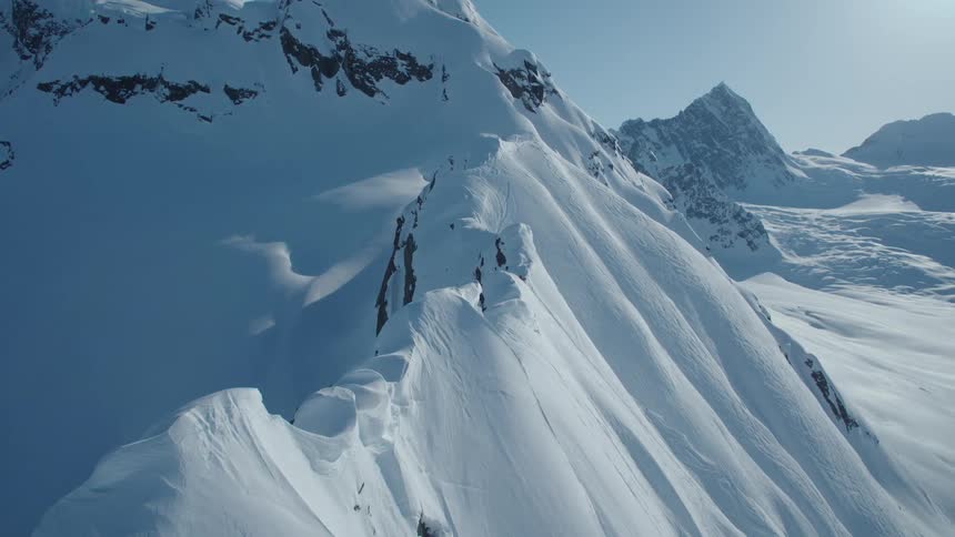 Cliff and mountains covered by snow
