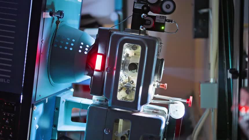 Analog film projection machine with visible components