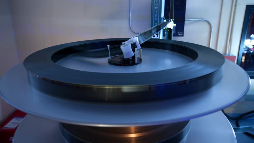 Machine in operation with a roll of film tape in motion