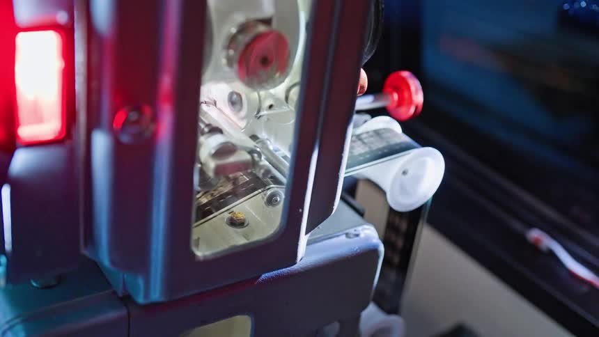 A close up of a film processing machine or a digital scanner for film
