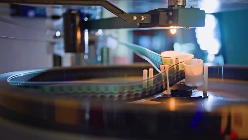 Close up of a moving machine with a film strip