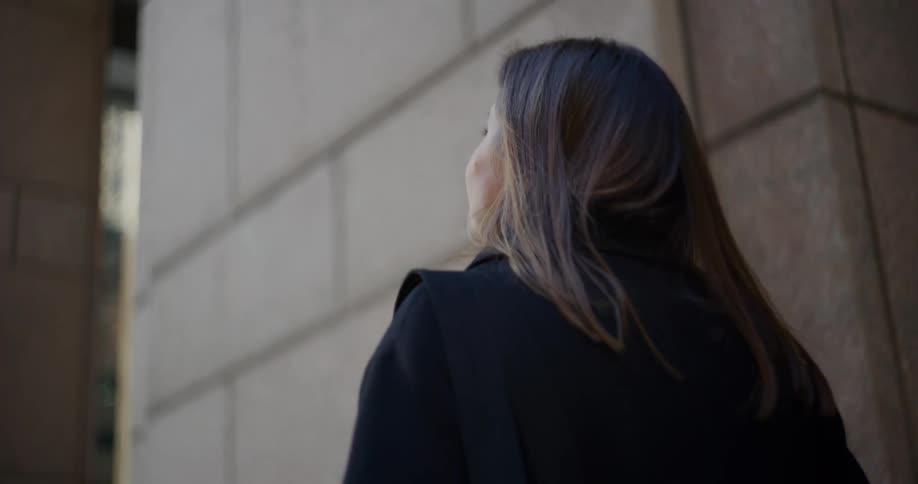 Woman seen from behind walking