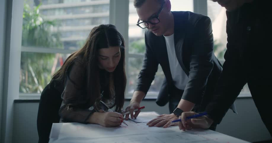 A clip of workers having a deliberation in the office