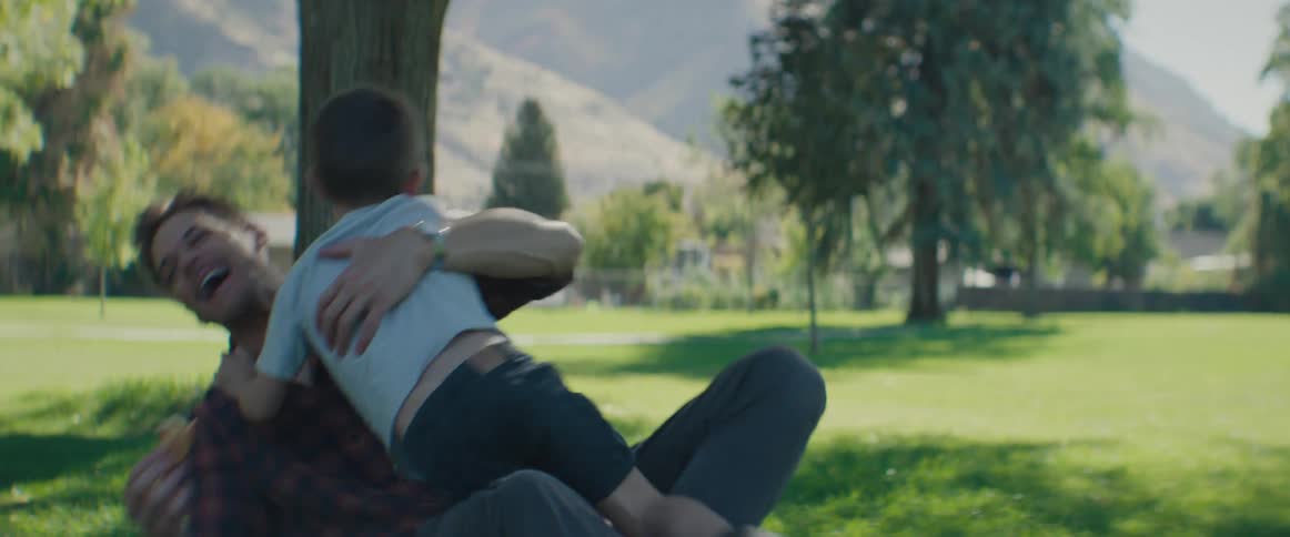 Father and son play in the park