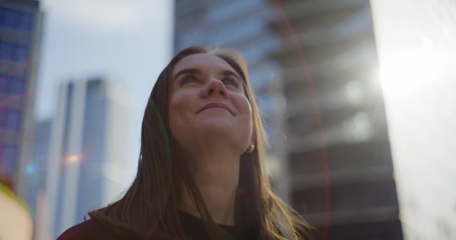 A clip of a female looking around with a smile