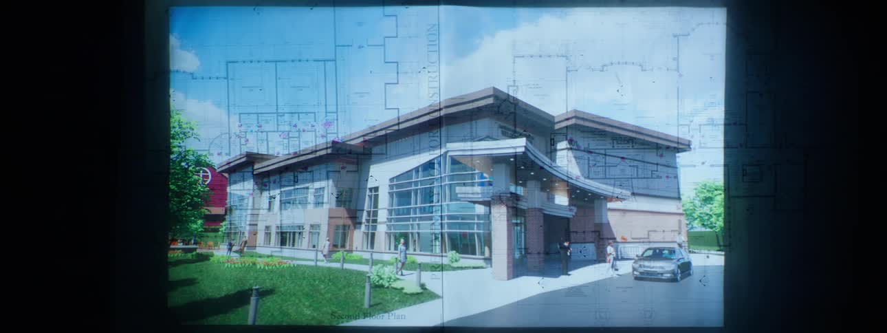 Slide projected on the wall with architecture of buildings and houses
