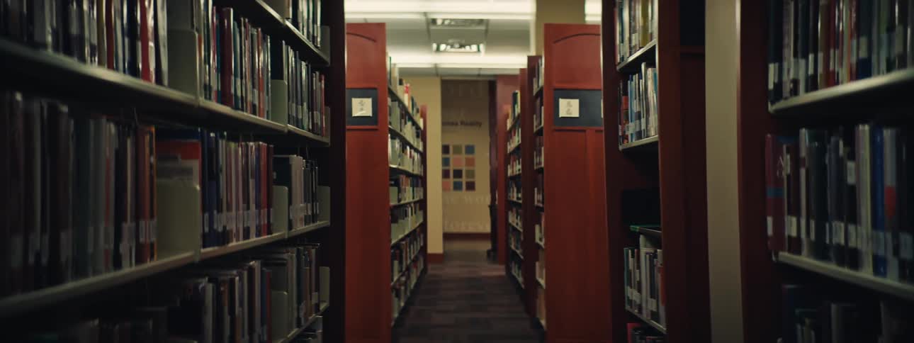 A row of book shelves on a library