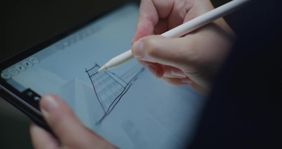 A person is sketching on the tablet