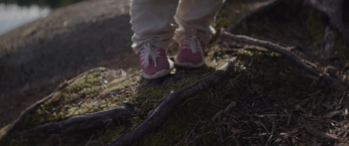 A child walks by the water