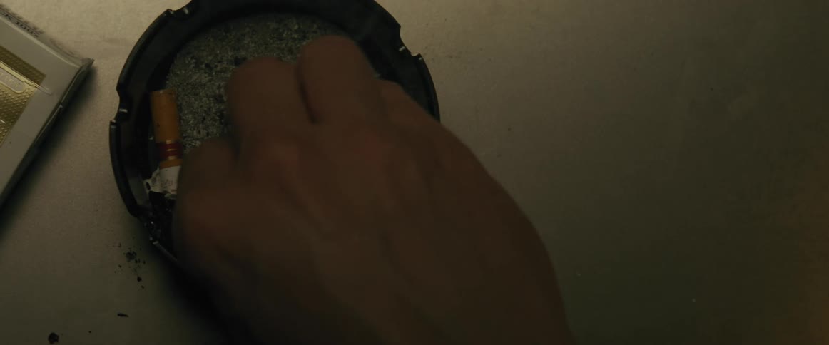 A person puts out his cigarette