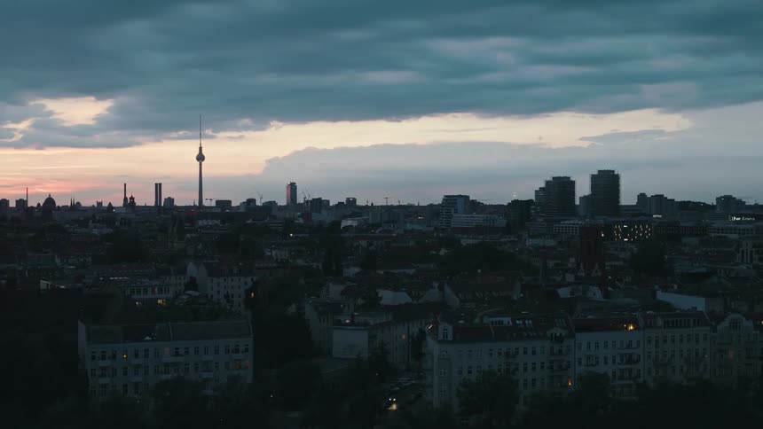 The sun is rising on the city