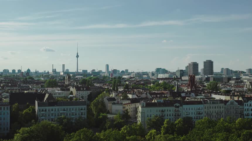 Aerial panorama of an urban city with modern buildings and houses