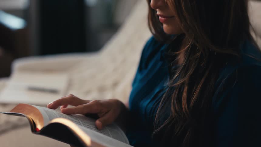 A clip of a lady reading and studying