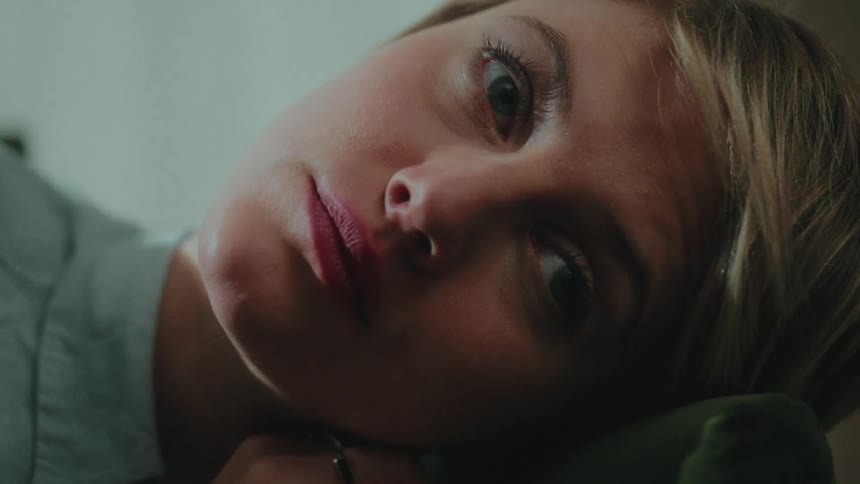 Close up of a thoughtful blonde womans face