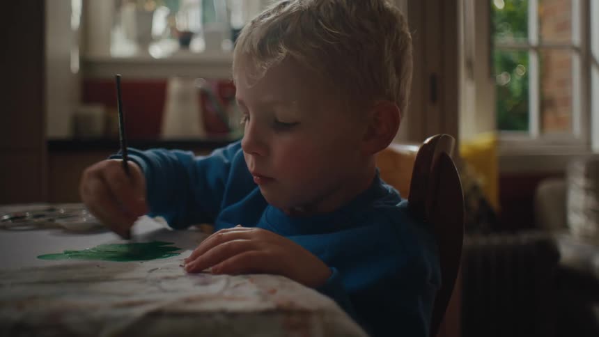A child is coloring at home