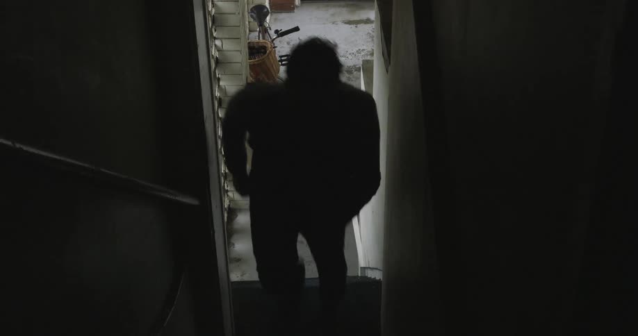 Man walking up some steps from outside