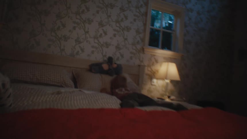 Boy jumping and throwing himself on the bed