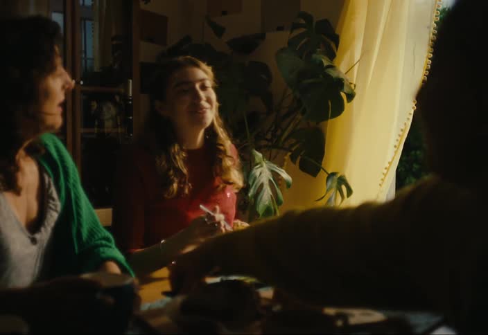 Friends have a meal together at the table