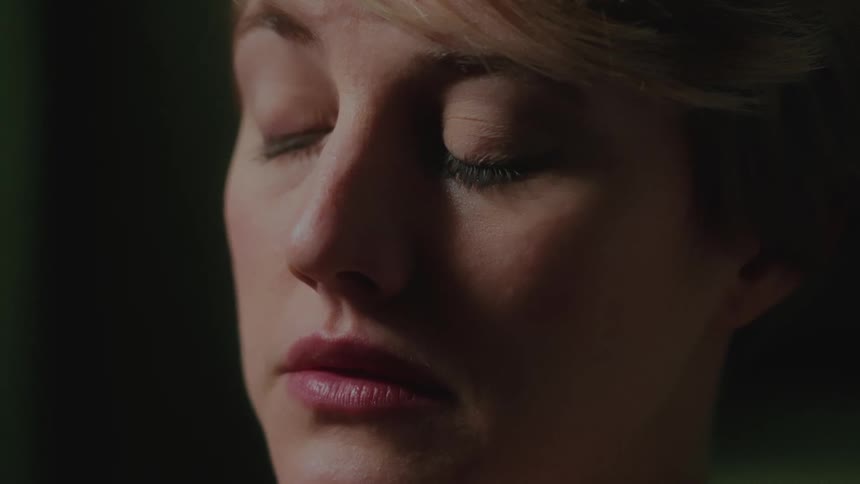 Portrait of a young blonde woman with light eyes