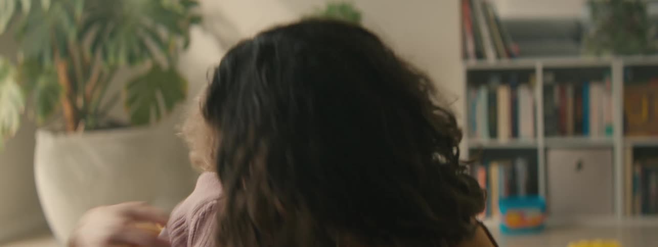 Mother and daughter sitting together playing